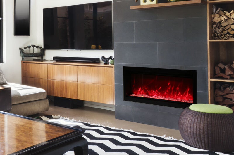 amantii symmetry series recessed/wall-mount smart electric fireplace installed in a living room next to a tv