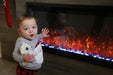 modern flames allwood fireplace wall system for modern flames spectrum slimline 60" electric fireplace with a child touching the glass showing that it is safe for kids to be around