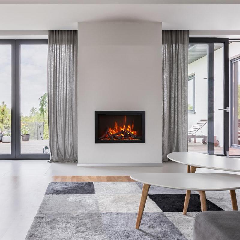 amantii traditional built-in electric fireplace insert installed in a modern reading room
