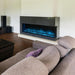 modern flames landscape pro multi 3 sided smart electric fireplace installed in a modern living room with blue flames