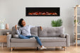 amantii symmetry bespoke 74-inch wall-mount/recessed electric fireplace installed in living room with woman sitting on couch