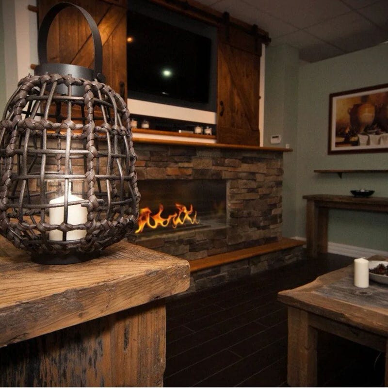 The bio flame 60-inch firebox single-sided ethanol fireplace installed in a luxury rustic dining room