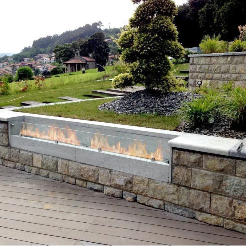 the bio flame 60-inch indoor/outdoor ethanol fireplace burner installed outdoors on a deck