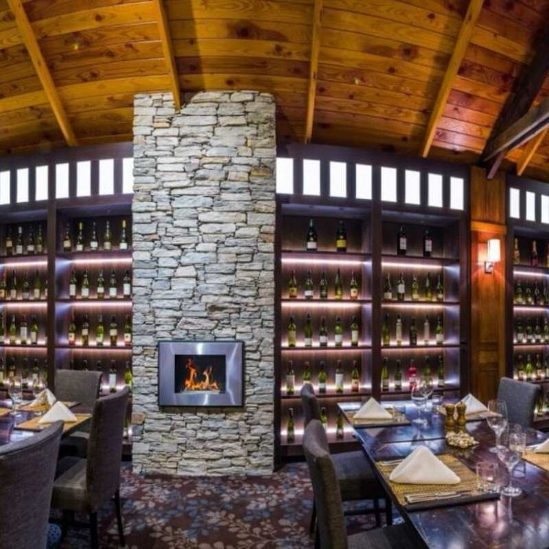The bio flame fiorenzo 33-inch built in or wall mounted ethanol fireplace  installed in a winery dining area