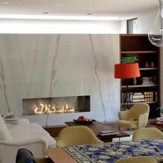 the bio flame 72-inch single sided built-in ethanol burner fireplace installed in a living room with furniture