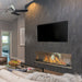 the bio flame 72-inch single sided built-in ethanol burner fireplace installed in a living room underneath a television